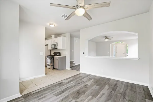 a kitchen with a sink cabinets and window
