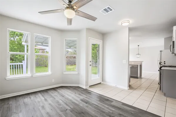 a kitchen with stainless steel appliances a refrigerator sink and cabinets