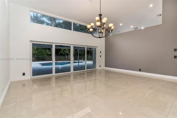 an empty room with a chandelier