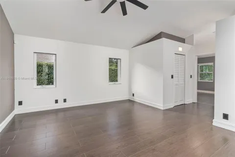 a view of kitchen with kitchen island and stainless steel appliances