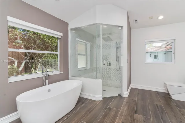 a bathroom with a bathtub and a sink