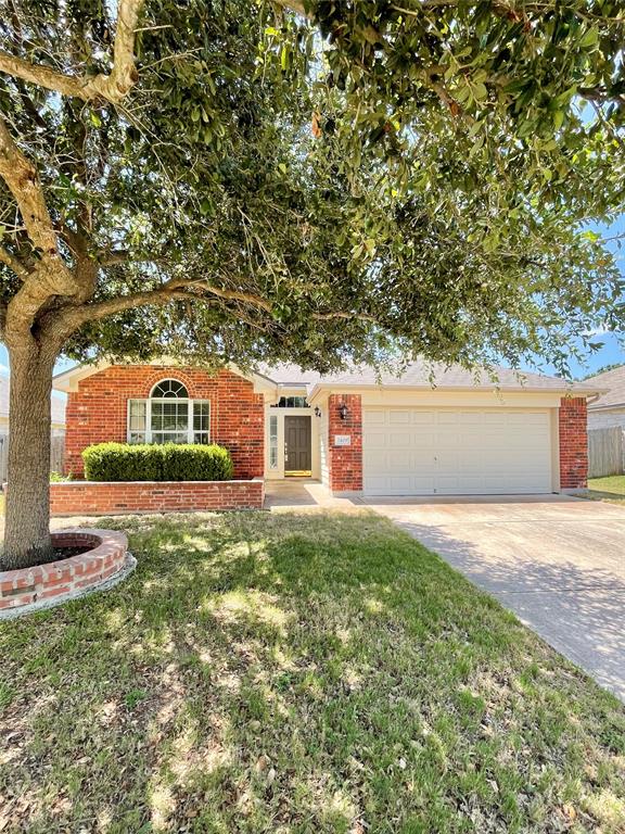 2409 Romeo Drive Cedar Park, TX 78613 - Photo 1 of 22 a front view of a house with a yard