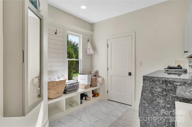 a room with a couch and a stove top oven