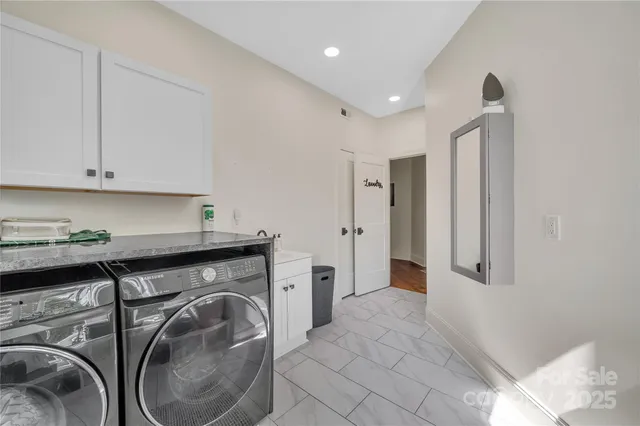 a view of a storage & utility room with washer and dryer