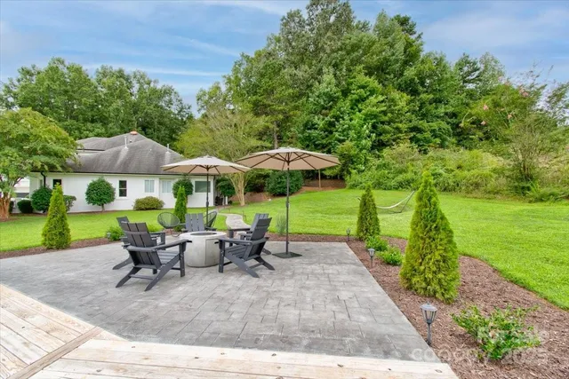 a view of backyard with outdoor seating