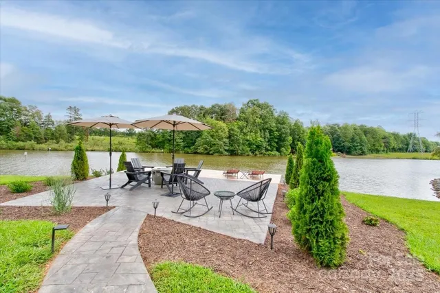 a view of a fountain with a bench in roof deck