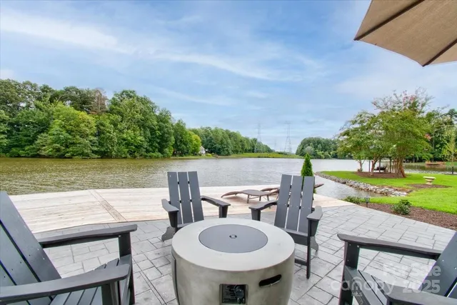 a view of a chairs and table in patio