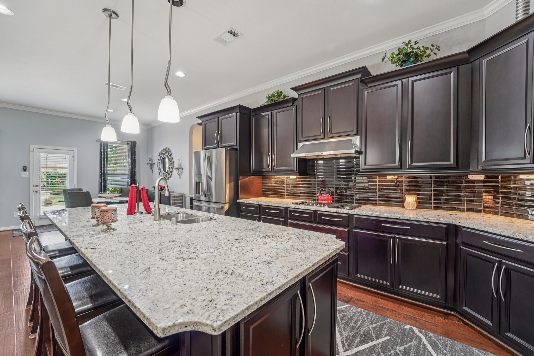 3511 Winding Point Lane Katy, TX 77494 - Photo 12 of 35 a kitchen with granite countertop a sink appliances and cabinets