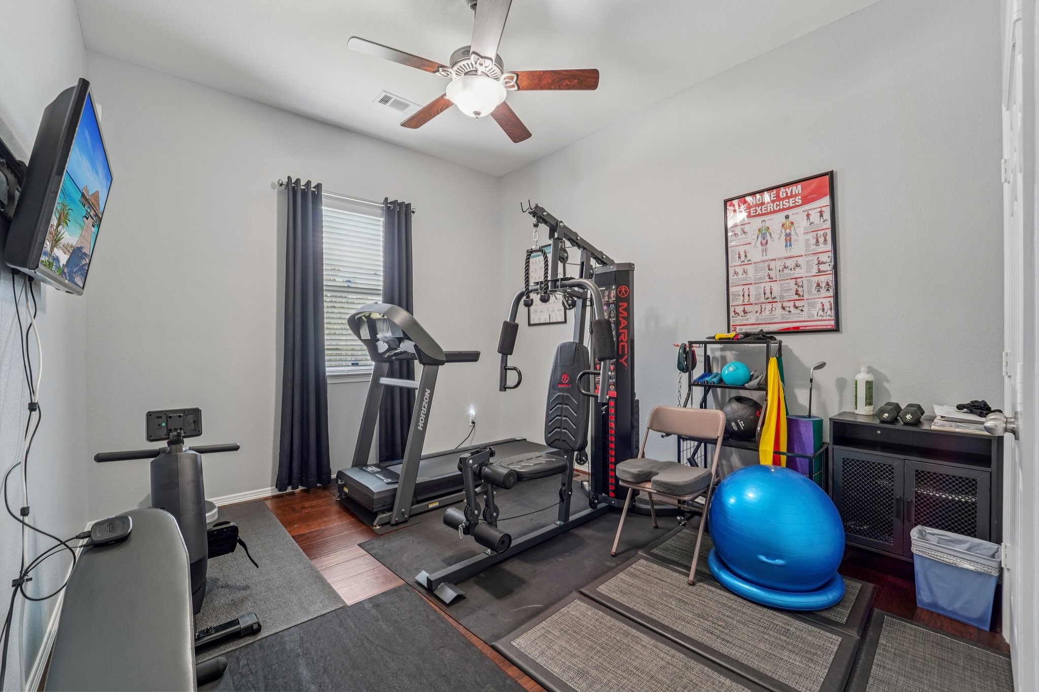 3511 Winding Point Lane Katy, TX 77494 - Photo 22 of 35 a room with gym equipment and windows