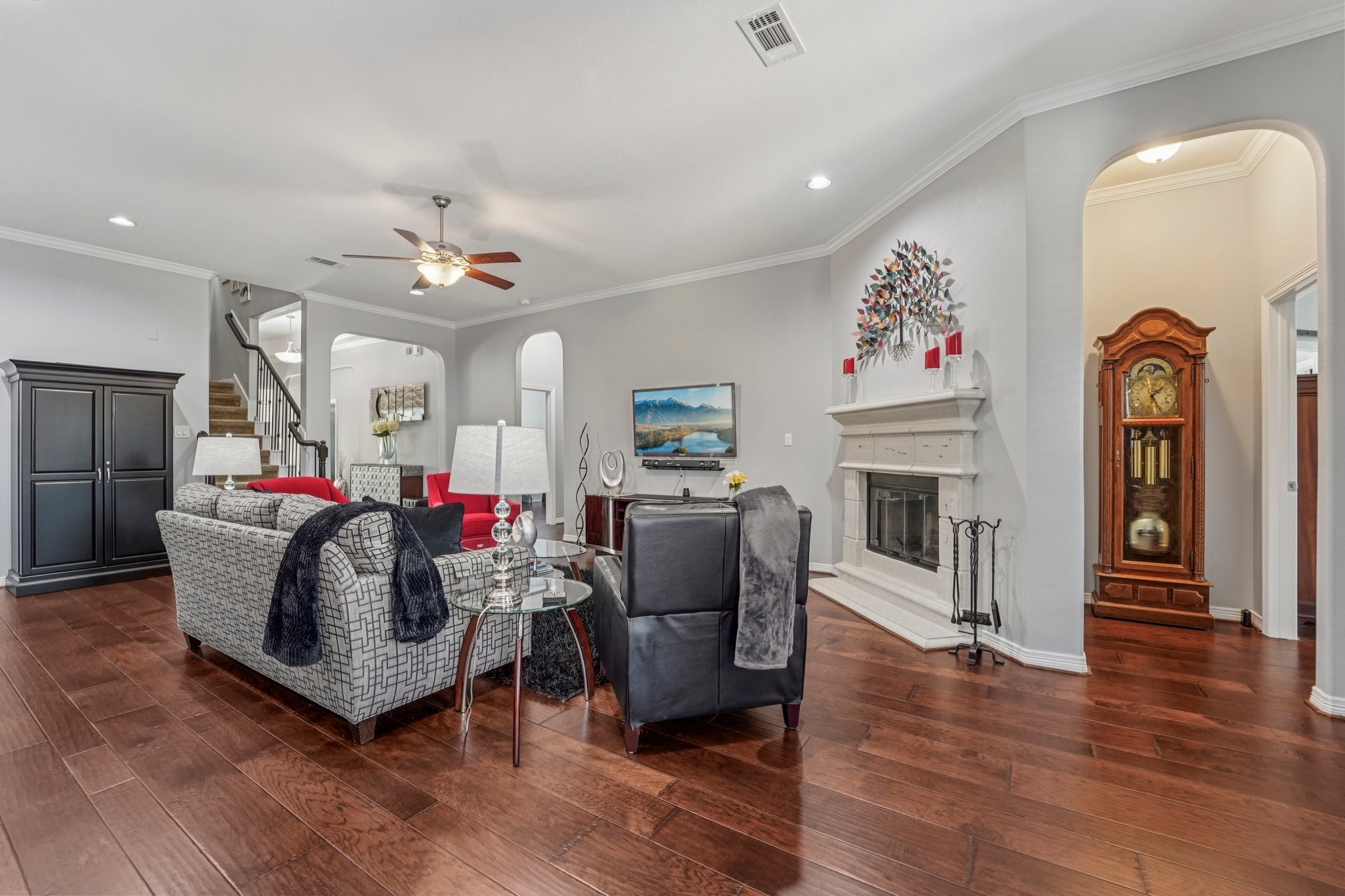 3511 Winding Point Lane Katy, TX 77494 - Photo 10 of 35 a living room with furniture a fireplace and wooden floor