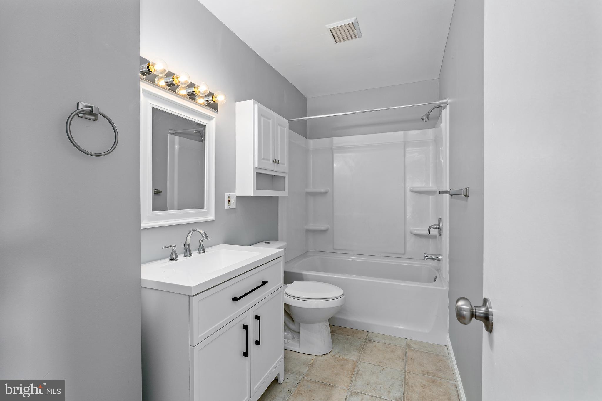 10 North Hills Drive Rising Sun, MD 21911 - Photo 19 of 28 a bathroom with a double vanity sink toilet mirror and shower