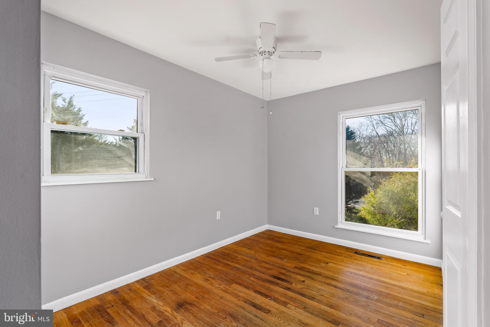10 North Hills Drive Rising Sun, MD 21911 - Photo 21 of 28 a view of an empty room with wooden floor and a window