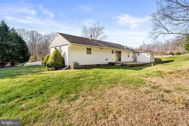 a view of a house with a yard and garage