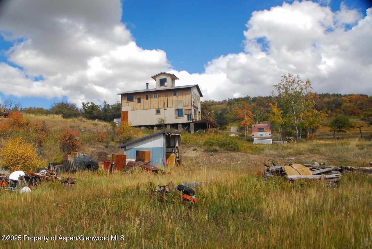 510 South Fork Road Rifle, CO 81650 - Photo 11 of 13 a view of a lake with a houses in the background