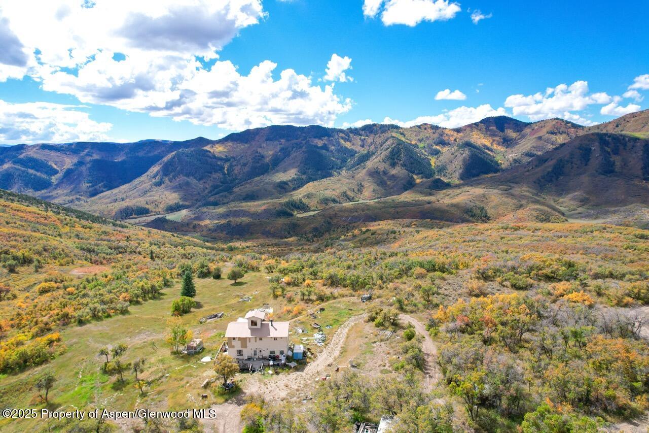510 South Fork Road Rifle, CO 81650 - Photo 2 of 13 a view of a backyard of a house with a mountain