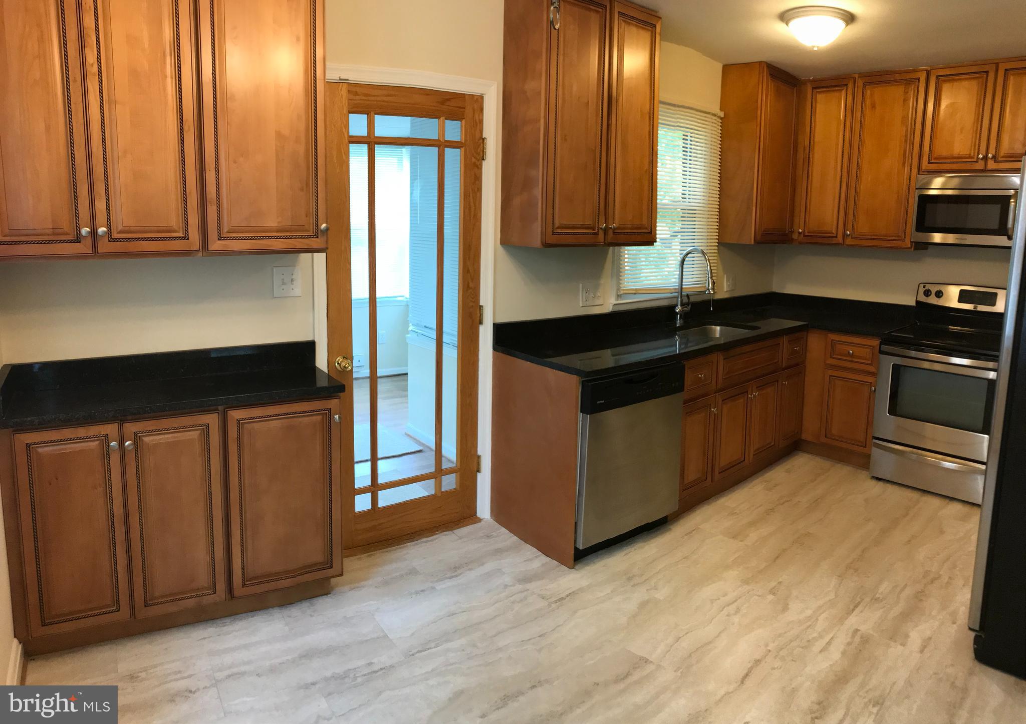 3510 Milford Mill Road Baltimore, MD 21244 - Photo 5 of 24 Kitchen & nook area / door to dining room