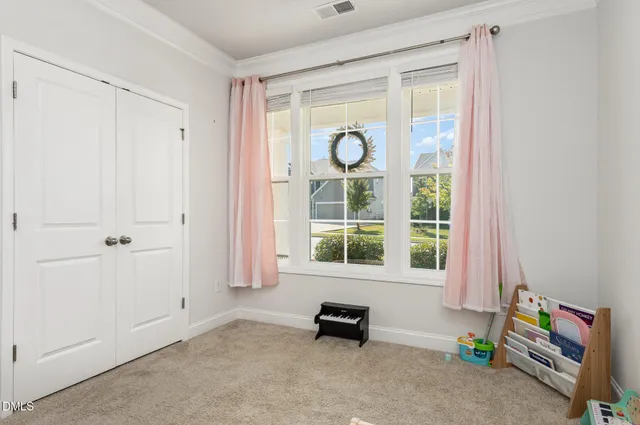 a kitchen with kitchen island granite countertop a sink cabinets and refrigerator