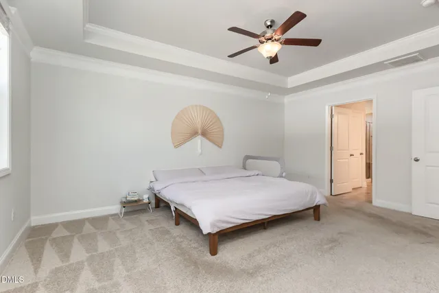 a view of a hallway view with wooden floor and a living room