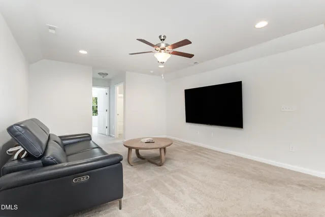 a en suite bathroom with a granite countertop vanity mirror and shower