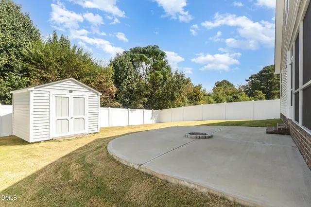 an empty room with closet and a chandelier fan