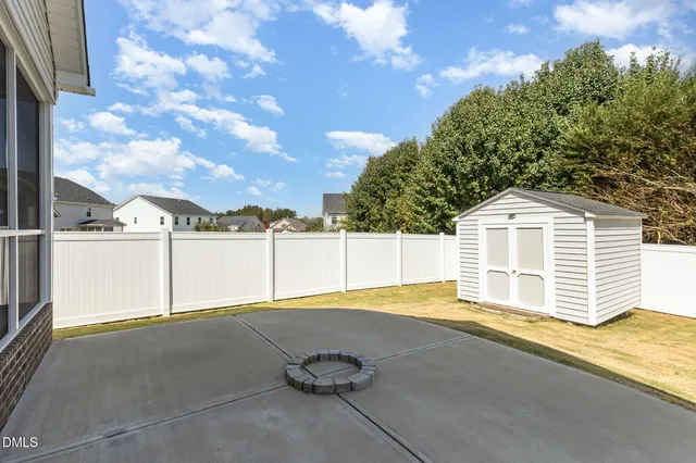 a utility room with cabinets washer and dryer