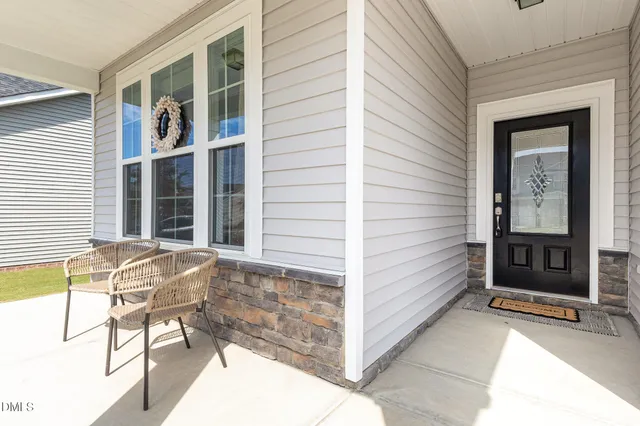 a picture of a bench in front of a wall