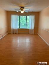 4961 East 10 Mile Road, Unit 5 Warren, MI 48091 - Photo 4 of 8 10 Mile Living room 2.jpeg