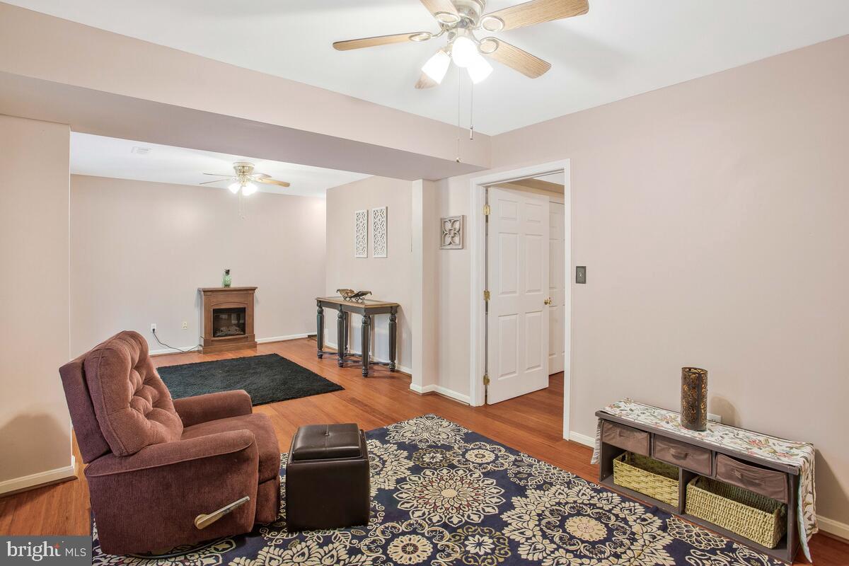165 Ball Road St. Leonard, MD 20685 - Photo 43 of 55 a living room with furniture and a rug