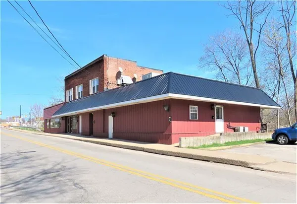 a front view of a house with a garage