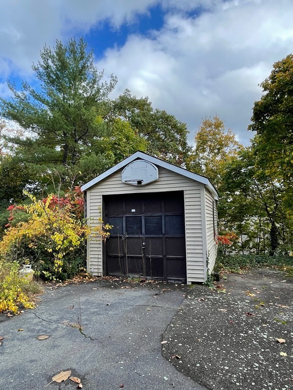 65 Beacon Street Melrose, MA 02176 - Photo 2 of 13 a view of a house with a yard and garage