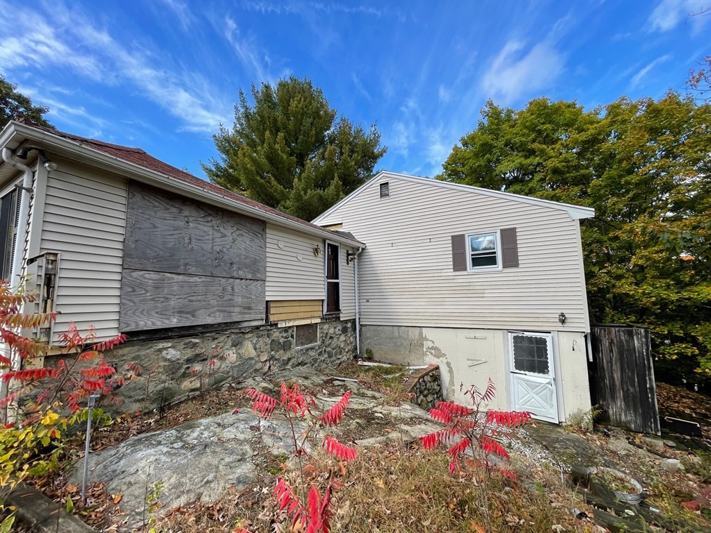 65 Beacon Street Melrose, MA 02176 - Photo 3 of 13 a view of a house with a yard