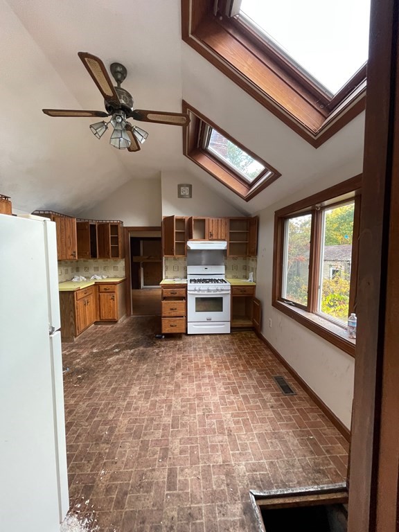 65 Beacon Street Melrose, MA 02176 - Photo 9 of 13 a view of a kitchen with furniture and windows