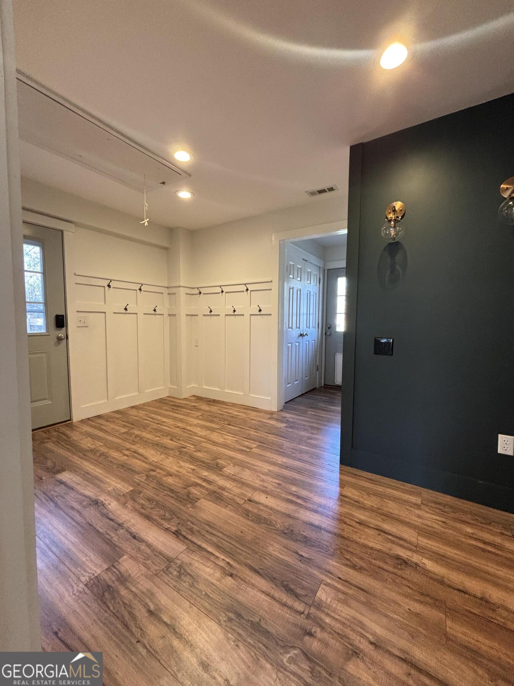 14 Emory Street Newnan, GA 30265 - Photo 11 of 27 a view of a hallway with wooden floor
