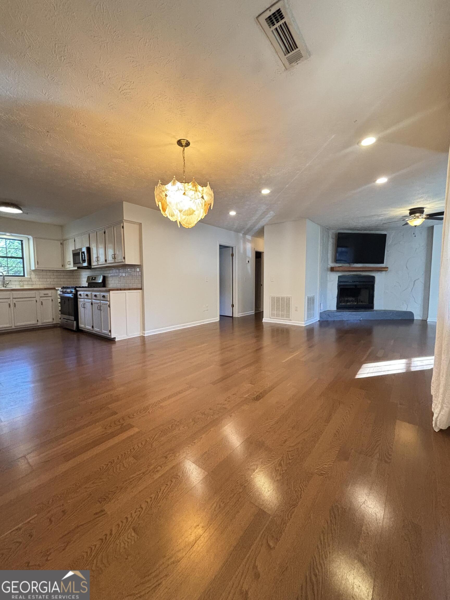14 Emory Street Newnan, GA 30265 - Photo 6 of 27 a view of kitchen with cabinets and wooden floor