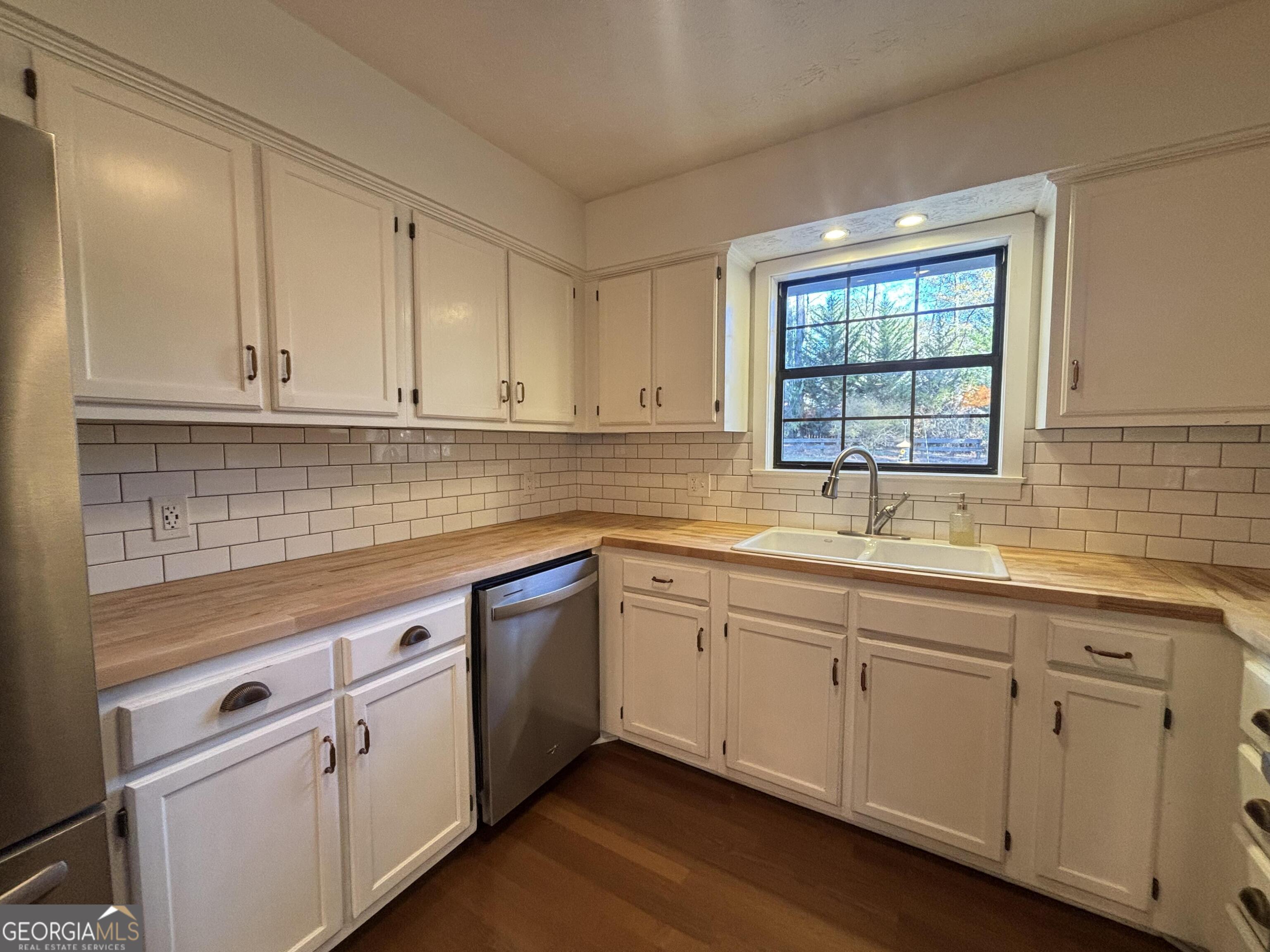 14 Emory Street Newnan, GA 30265 - Photo 8 of 27 a kitchen with sink cabinets and window