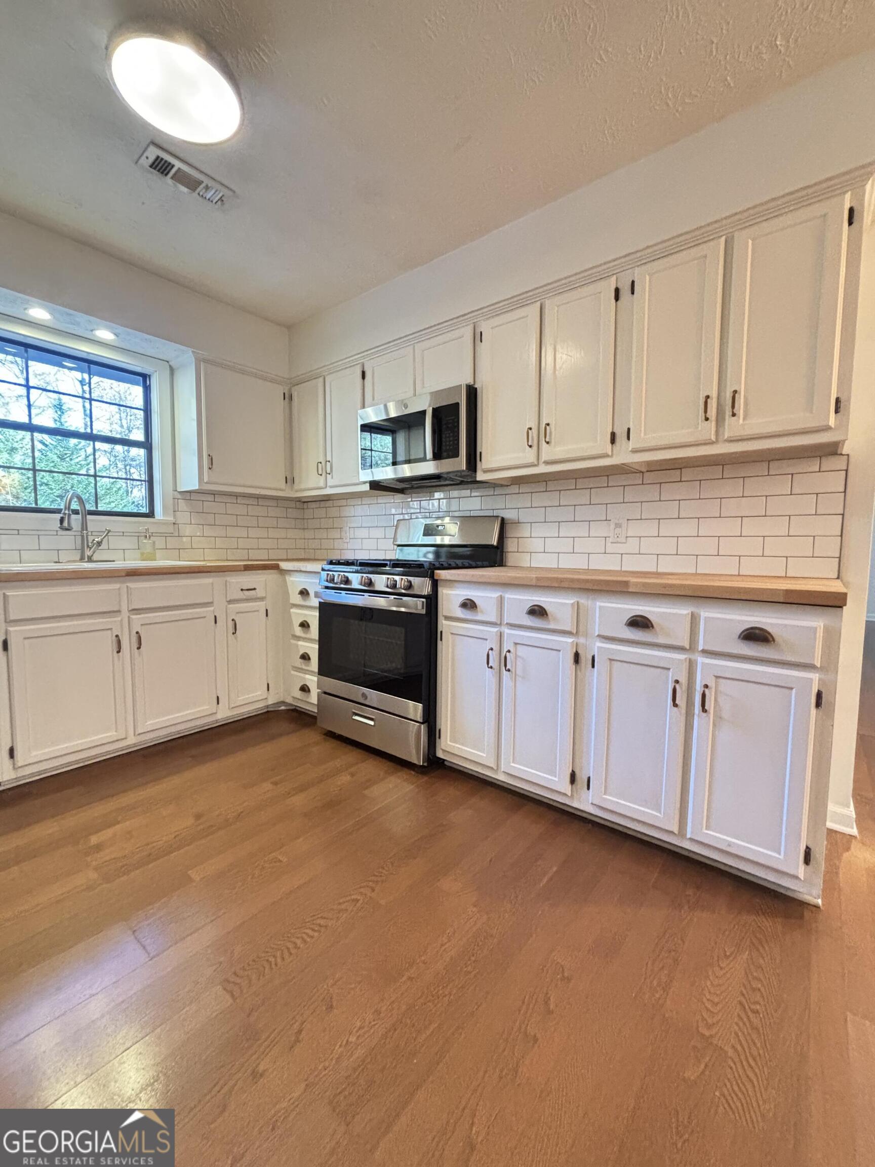 14 Emory Street Newnan, GA 30265 - Photo 9 of 27 a view of a kitchen with electric appliances