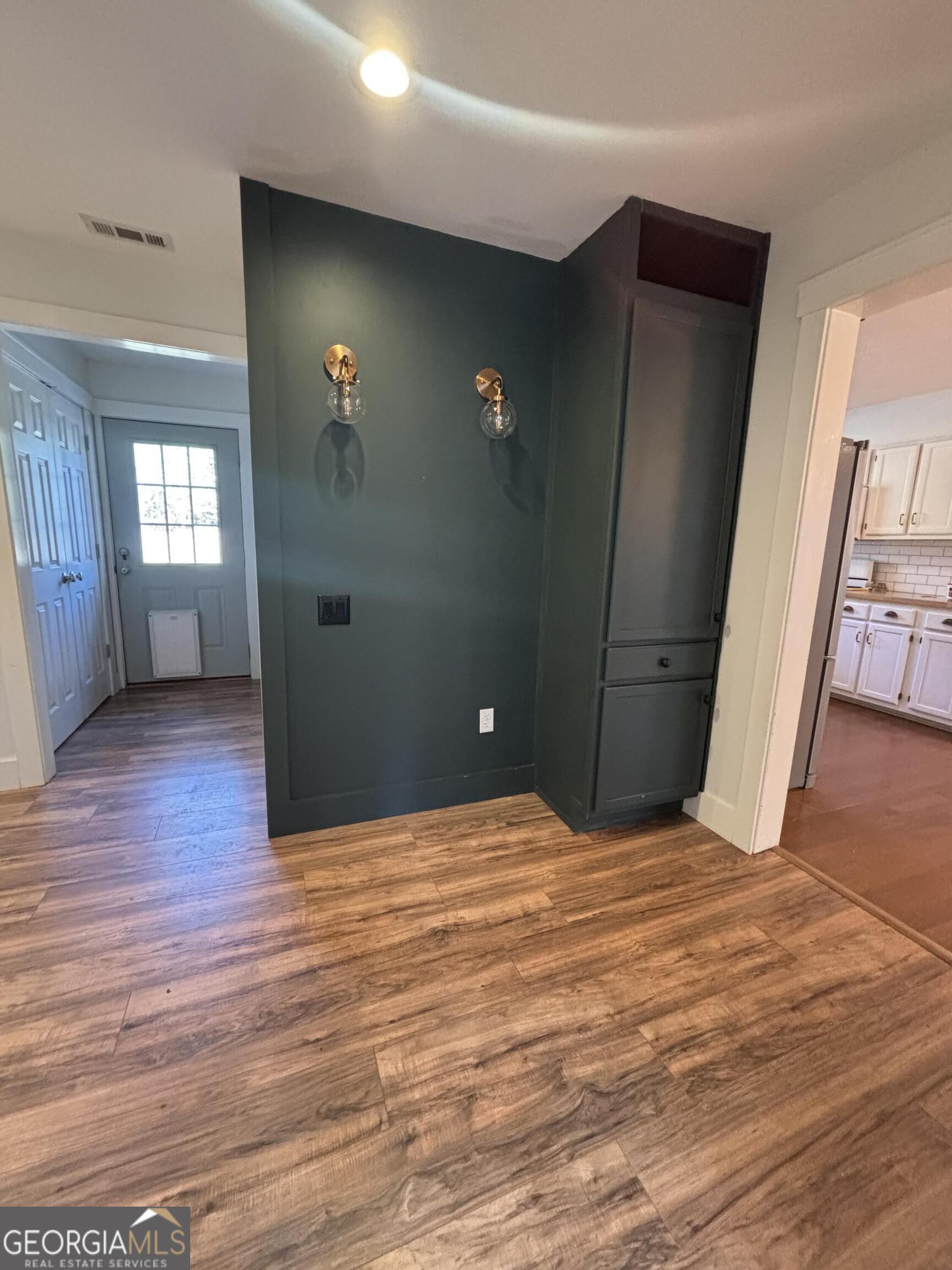 14 Emory Street Newnan, GA 30265 - Photo 10 of 27 a view of empty room with window and wooden floor