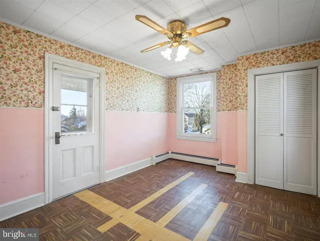 a view of an empty room with a window