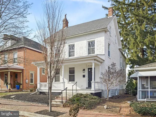 front view of a building with a bench