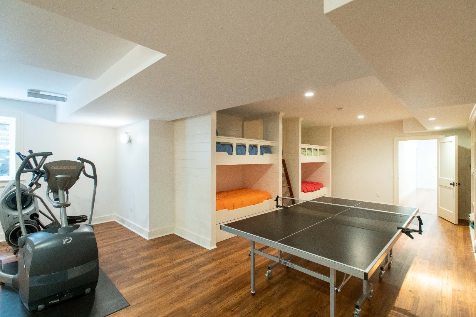 146 Surfside Road Nantucket, MA 02554 - Photo 37 of 43 a room with wooden floor and gym equipment