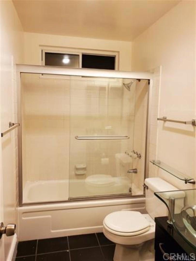 6701 Paseo Del Norte, Unit E Carlsbad, CA 92011 - Photo 13 of 23 a bathroom with a shower a toilet and a sink
