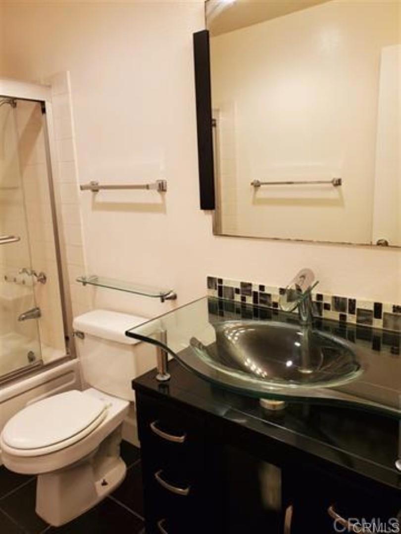 6701 Paseo Del Norte, Unit E Carlsbad, CA 92011 - Photo 14 of 23 a bathroom with a sink and a toilet