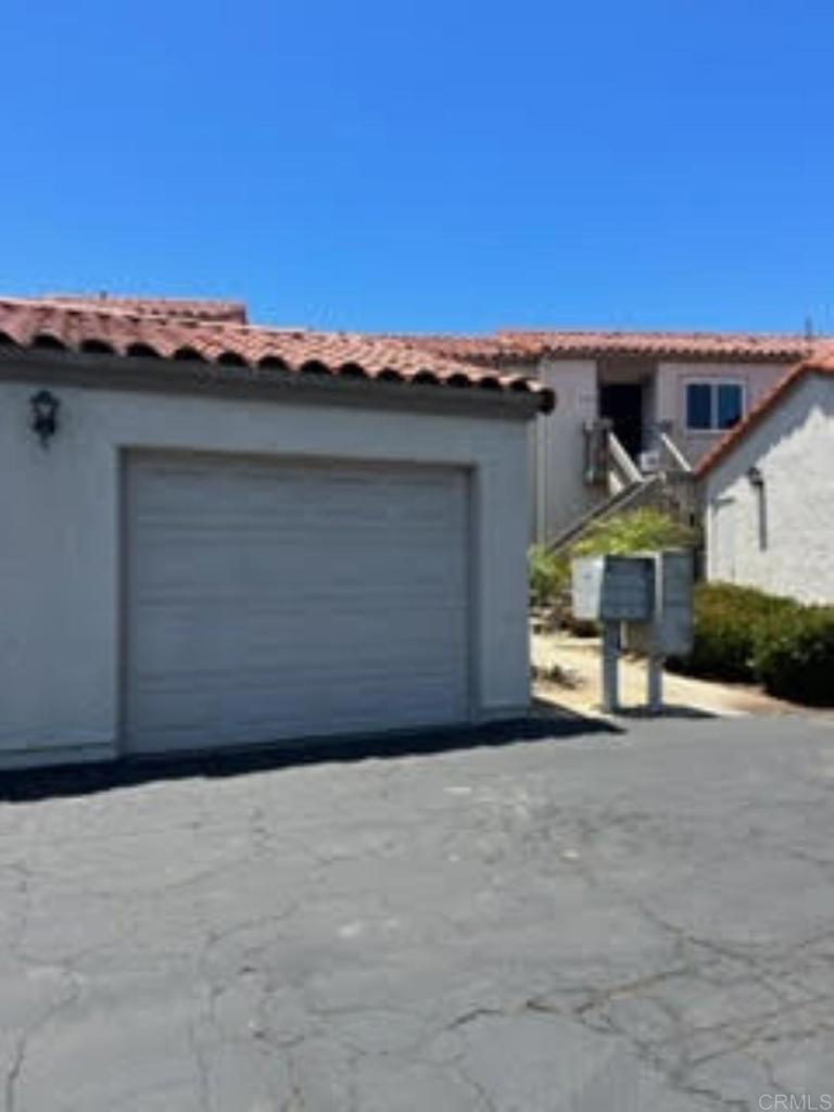 6701 Paseo Del Norte, Unit E Carlsbad, CA 92011 - Photo 16 of 23 a view of a car garage