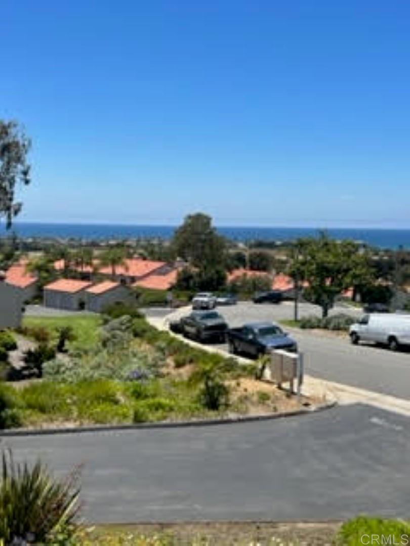 6701 Paseo Del Norte, Unit E Carlsbad, CA 92011 - Photo 19 of 23 a view of a lake with houses