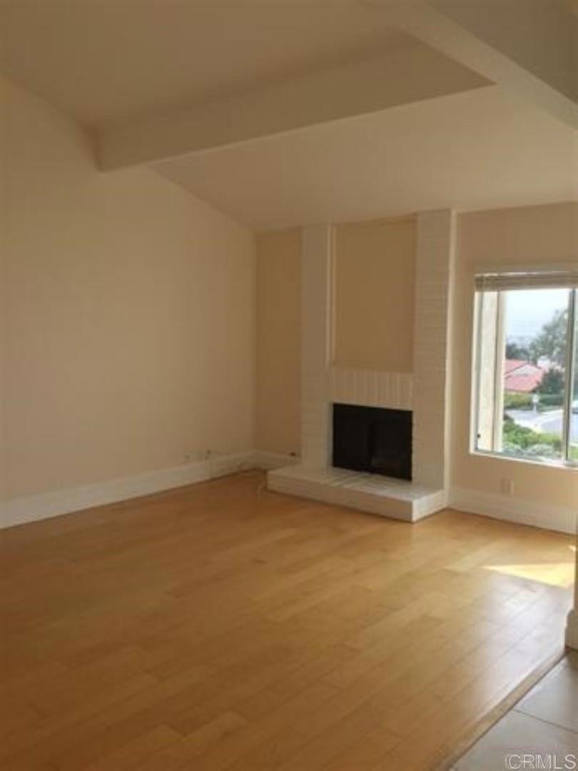 6701 Paseo Del Norte, Unit E Carlsbad, CA 92011 - Photo 6 of 23 an empty room with windows