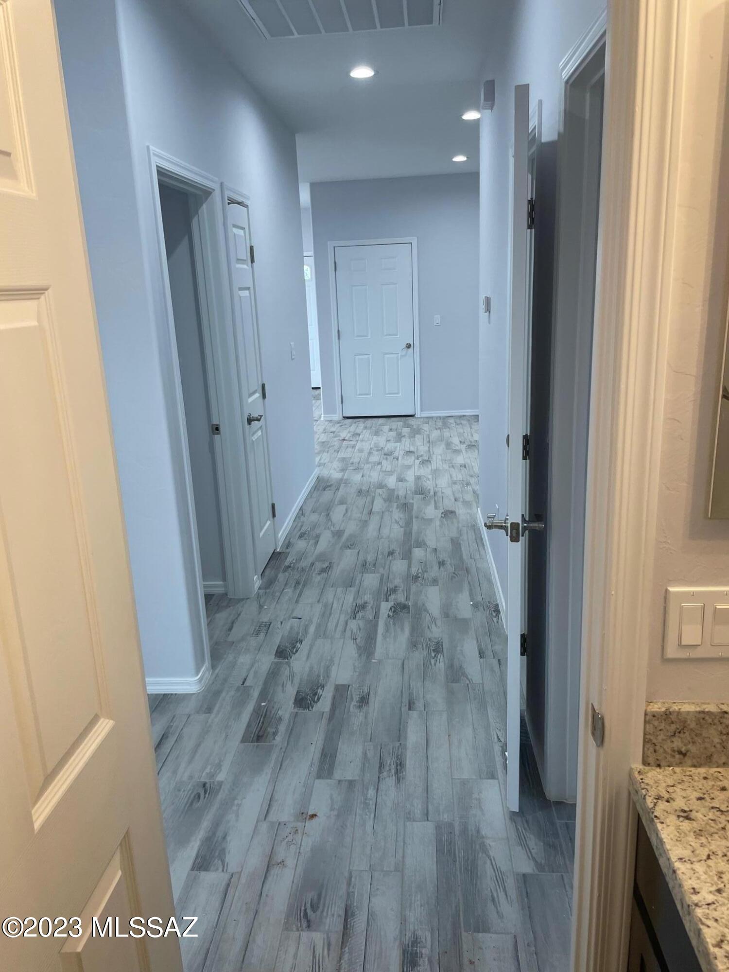 1817 Via Nueva Zelandia Rio Rico, AZ 85648 - Photo 8 of 16 a view of hallway with wooden floor
