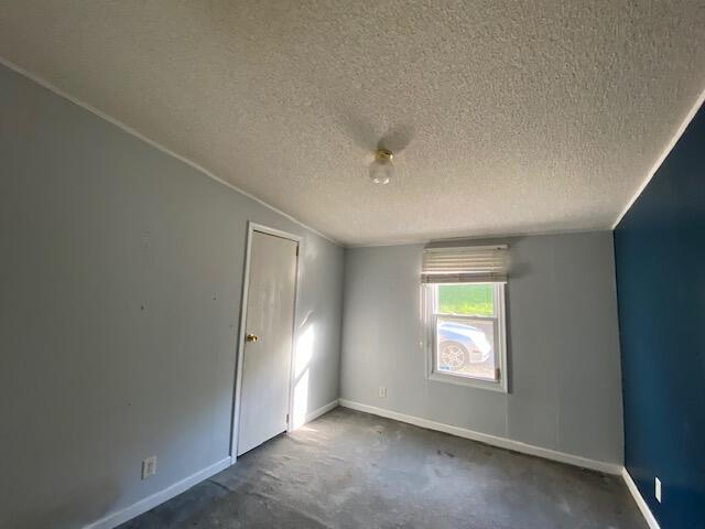 208 Board Mountain Road Goodview, VA 24095 - Photo 11 of 11 an empty room with windows and closet