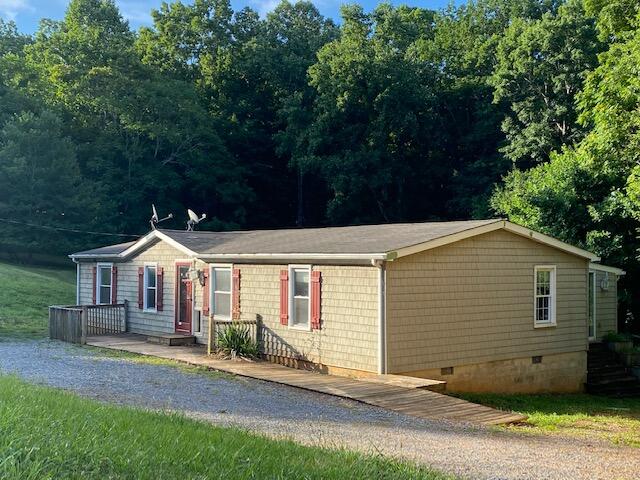208 Board Mountain Road Goodview, VA 24095 - Photo 3 of 11 front view of a house with a yard
