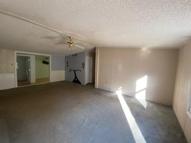 208 Board Mountain Road Goodview, VA 24095 - Photo 4 of 11 a view of empty room with window and chandelier fan