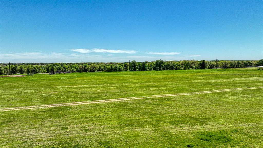 Lot 4-5 Lamkin Road Mineral Wells, TX 76067 - Photo 10 of 10 a view of a big yard with an outdoor space